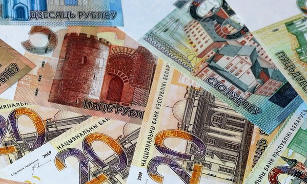 Belarusian ruble money bills in pile on table. Belarus BYN currency cash close up
