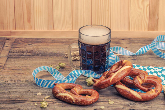 Traditional Oktoberfest set. Pretzels and beer, German festival food concept. Trendy hard light