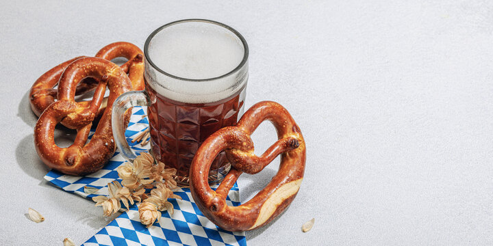 Traditional Oktoberfest set. Pretzels and beer, German festival food concept. Trendy hard light