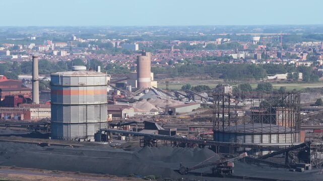 Aerial drone view of a heavy metallurgical plant producing steel. Industrial facility with manufacturing buildings and infrastructure.