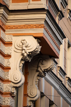 Classic historic building facade decorative stone bracket sculpture close up.
