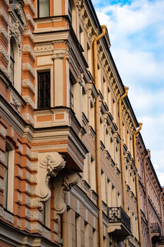 Classic historic building facade decorative stone bracket sculpture close up.

