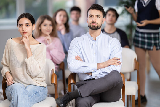 Young people attend lectures on driving and traffic rules in a modern driving school