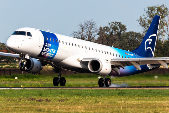 Air Montenegro Embraer 195 (4O-AOE) with landing gear smoke at Bratislava International Airport on August 6, 2025 in Bratislava, Slovakia