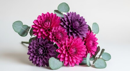 Fototapeta premium Vibrant handmade crepe paper bouquet with fuchsia and plum dahlias mixed with silvery green eucalyptus leaves, elegant and lifelike display, bouquet, petal, festive