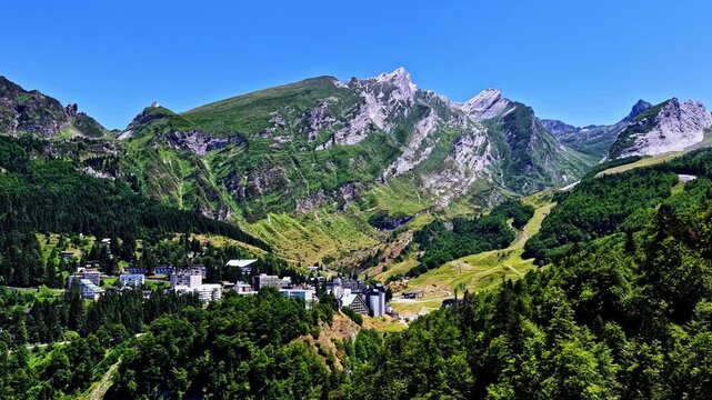 Mountain township surrounded by green nature and peaks in Col d'Aubisque.