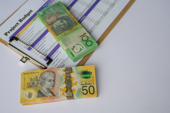 Budgeting and projects planning concept, Australian dollars note and clipboard showing budget management and business planning.