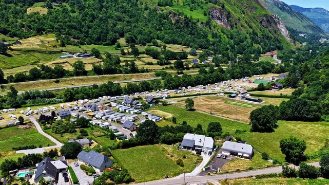 Green mountain pastures surrounding a campsite in France