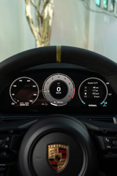 Modern Porsche 911 Interior View Displaying Alcantara Steering Wheel and Digital Dashboard Cluster