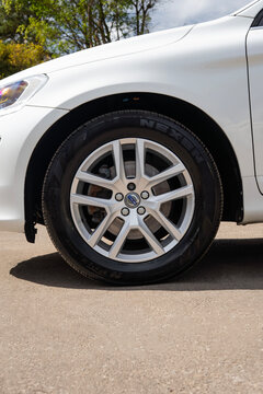 Close-up of Front Alloy Wheel and Tire of a White Volvo XC60 SUV
