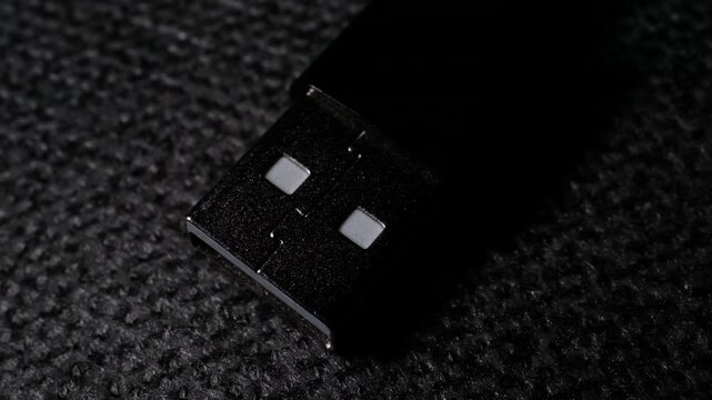 Black USB Type-A cable Plug Gradually Lighting up Macro Electronics Video