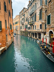 Traditional Gondola on Quiet Canal in Venice, Italy © Tristen