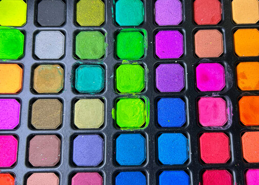 Large vibrant neon watercolor paint palette vector illustration, colorful makeup or face paint compact with multiple bright multi-colored square pans including green, purple, blue, pink, orange, and y