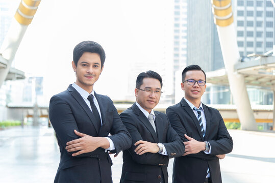 Happy asian business people team winners laughing give high five together join hands celebrating connection spirit good relation, successful teamwork victory, unity and teambuilding.teamwork