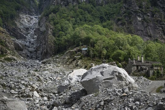 Devastation caused by debris and boulders, as a result of heavy rock and debris flow on the night of June 29-30, 2024 following heavy rains, Fontana hamlet, Bavona Valley or Val Bavona, Maggia Valley, Tessin, Switzerland