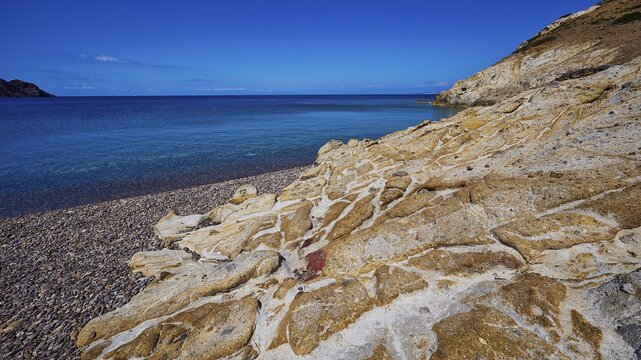 Rocky coast with turquoise water and blue sky, Lambi beach, pebble beach, Patmos, Dodecanese, Greek Islands, Greece