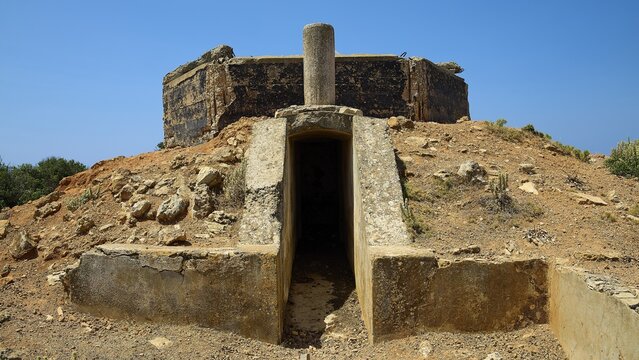 Entrance to a concrete structure on a rocky, dry hill, Lost Place, Air Defence Position, Aerophone, Parabolic Acoustic Mirror, Patella Mountain, WW2, west of Lakki, Leros, Dodecanese, Greek Islands, Greece