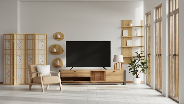 Modern japandi living room interior with blank tv screen on wooden cabinet and cozy armchair- 3D rendering