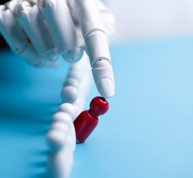 Robotic Finger Identifying Standing Out Red Person in a Crowd Concept of Management