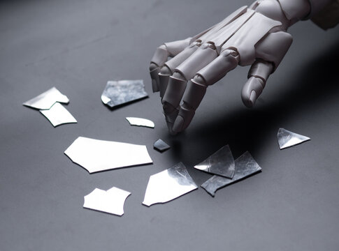 Robot Hand Touching Broken Glass Pieces Concept of System Error and Failure