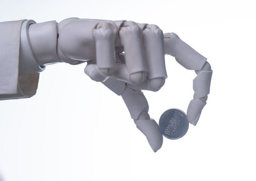 Robotic Hand Holding Blank Metal Coin Isolated on White Background