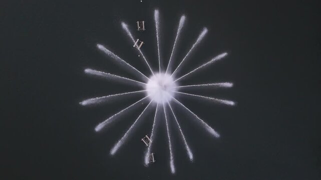 Aerial view of the Repuxos de Coimbra fountain spraying water in a star pattern in Coimbra, Coimbra, Portugal.