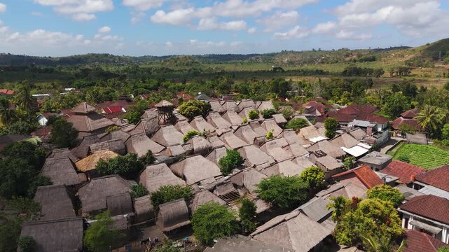 Pre-fire aerial footage of Sade Traditional Village in Lombok, showing the intact Sasak settlement in a left drone orbit before the devastating fire that later damaged the cultural landmark.