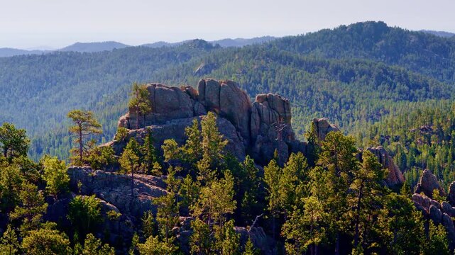 Drone shot showcasing the natural geological formations and scenic terrain of South Dakota's Black Hills.