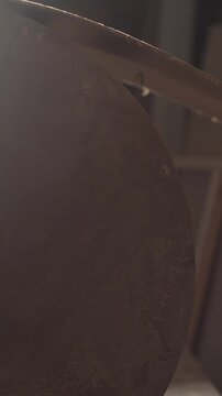 Sequence showing a hand carefully running over, smoothing and checking the large-format curved surface