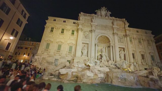 Nighttime Crowds at the Trevi Fountain in Rome, Italy &mdash; Baroque Landmark and Popular Tourist Spot