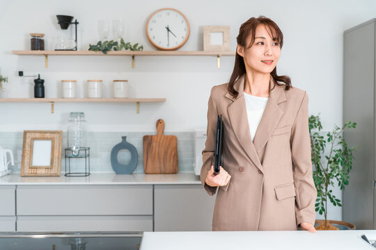 Female sales staff from several home builders who propose housing options at housing exhibitions and model homes.
