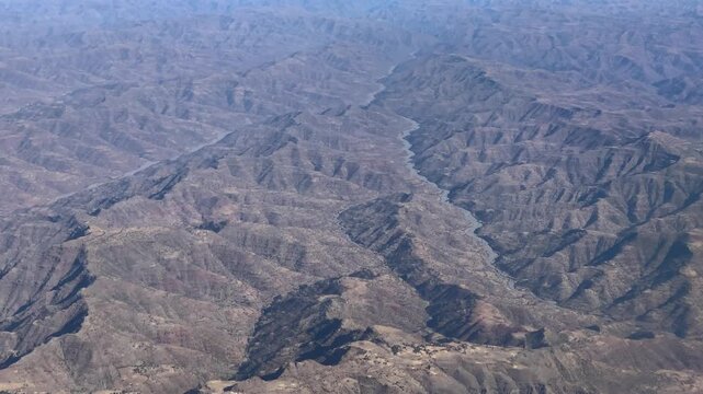 Aerial view of the rugged mountain landscape and deep river valley in Ethiopia.