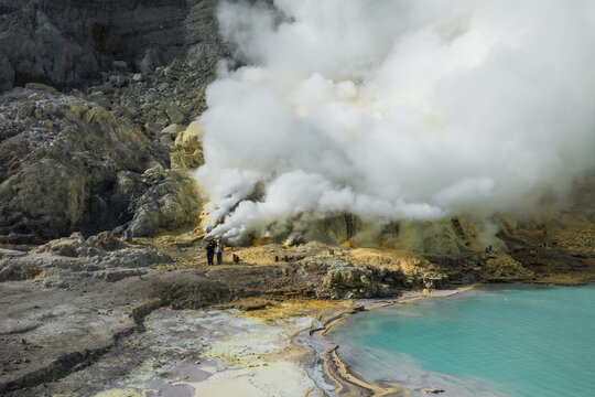 Aerial view of the sulfurous, smoking natural scenery of Ijen volcanic lake on Java Island, Indonesia.
