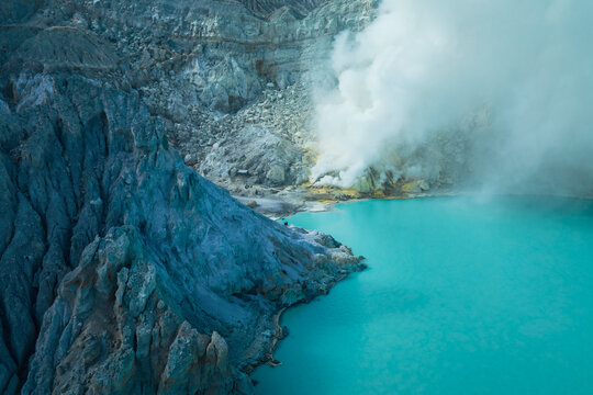 Aerial view of the sulfurous, smoking natural scenery of Ijen volcanic lake on Java Island, Indonesia.