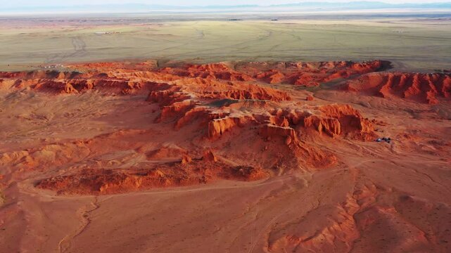 Aerial view of the red sandstone formations of the Flaming Cliffs in the Gobi Desert near Bulgan, Omnogovi, Mongolia.