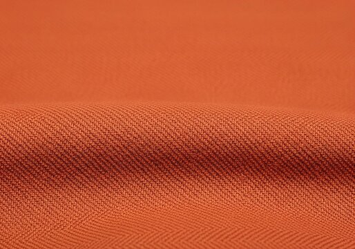 Vibrant orange fabric texture with diagonal weave pattern.