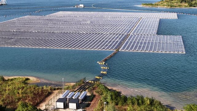 Aerial view of a large floating solar power farm on a lake, an innovative solution for generating clean, sustainable electricity using photovoltaic panels and renewable green energy technology