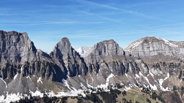 Detailed mountain landscape of the Churfirsten above Walenstadt, Switzerland, showing the distinctive limestone formations, sharp ridges and steep rock faces of the range. Sparse alpine vegetation