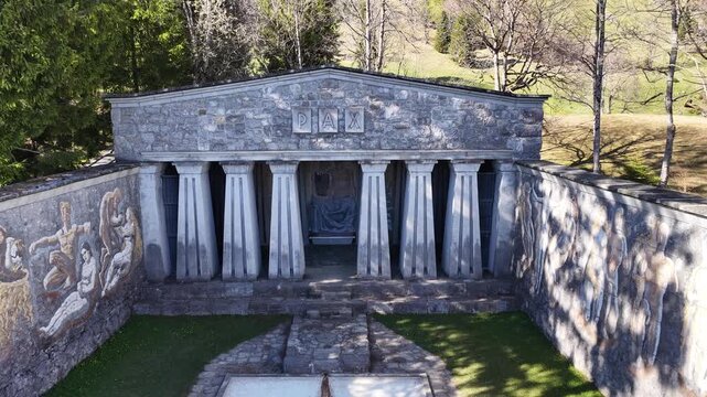Paxmal, a monumental peace memorial by Karl Bickel, stands in an alpine setting above Walensee, with its stone architecture and sculptural facade.