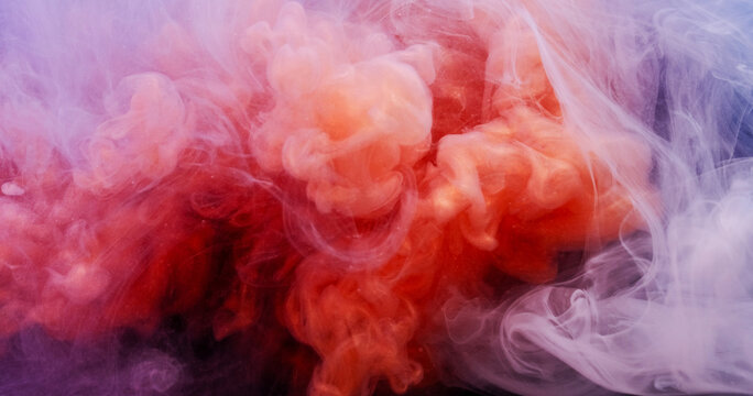 Color mist. Paint splash. Defocused red purple underwater vapor liquid glitter water bright texture spreading on abstract vibrant art background.