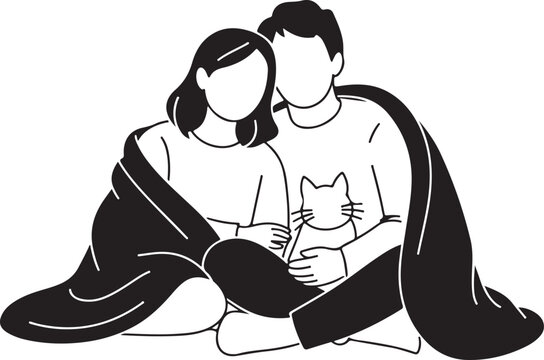 Teenage couple sitting together wrapped in a cozy blanket with a pet cat at home