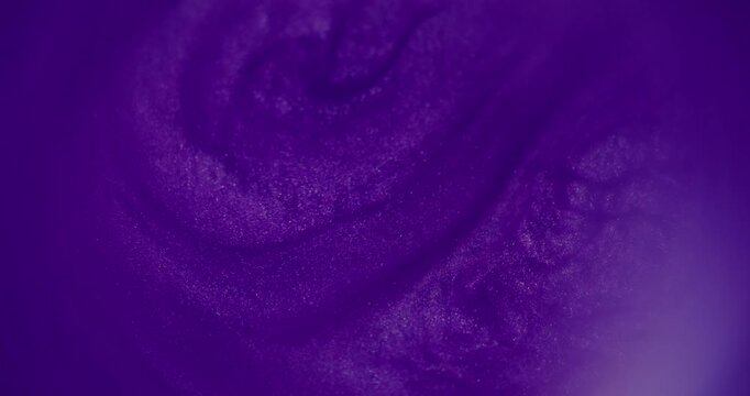 Defocused purple ink. Swirl dye. Blue color pigment cloud bright water mix glitter fluid twirl on abstract acrylic art background.
