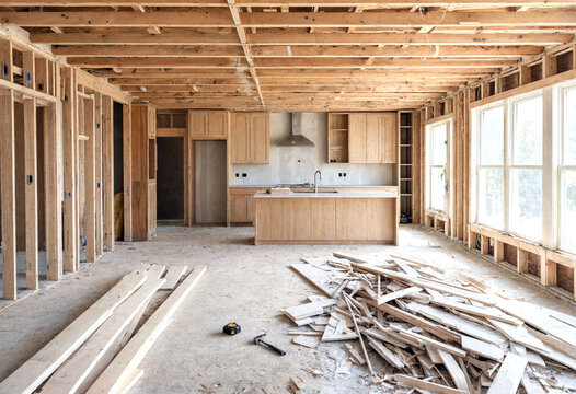 Modern kitchen under construction with wooden frames and unfinished walls in a new home renovation project