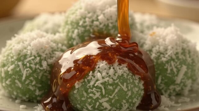 Delicious onde onde traditional Indonesian dessert sweet rice flour balls with palm sugar syrup and grated coconut