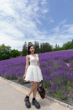 Woman with lavender field purple flower fields background.