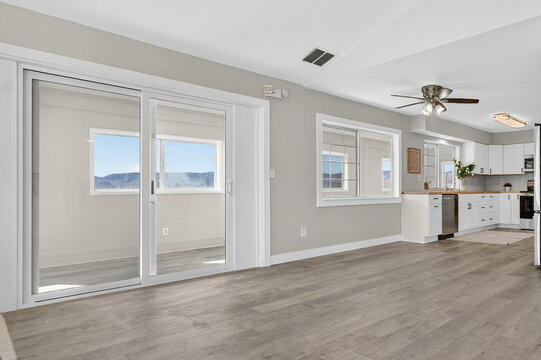 Bright open living area with sliding doors and kitchen