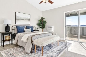 Naklejka premium Bright modern bedroom with balcony view