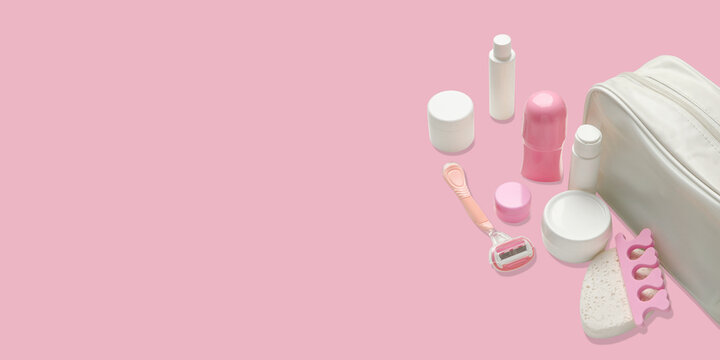 Cosmetics. Cosmetics and personal care items are arranged alongside a stylish toilet bag