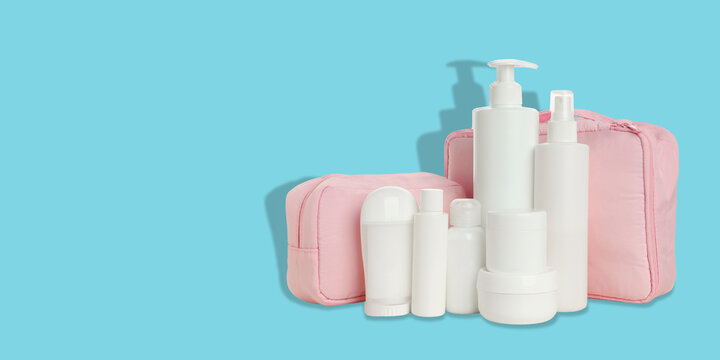 Cosmetics. Cosmetic containers are organized alongside a chic toilet bag