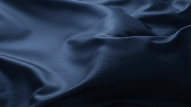 abstract dark blue silk fabric waves slow motion smooth satin luxury background
